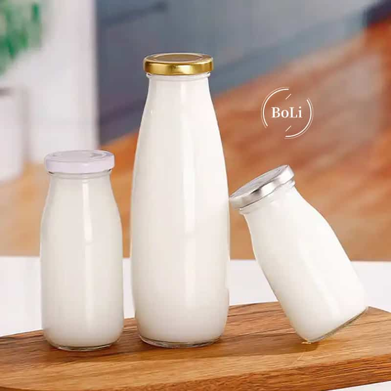 Customized 200ml 500ml round glass milk coffee beverage bottle with lid and empty glass juice bottle